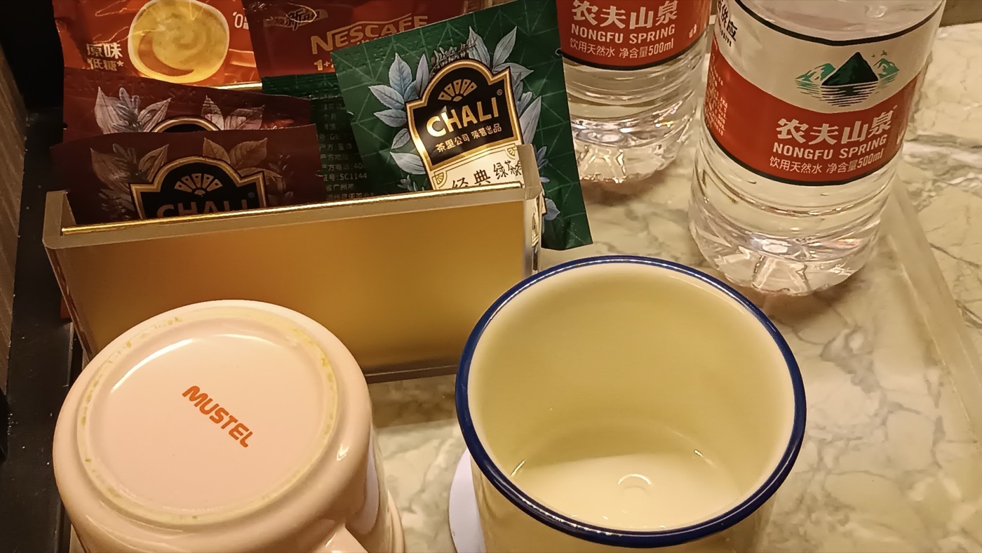Bottled water and a kettle in a Chinese hotel room