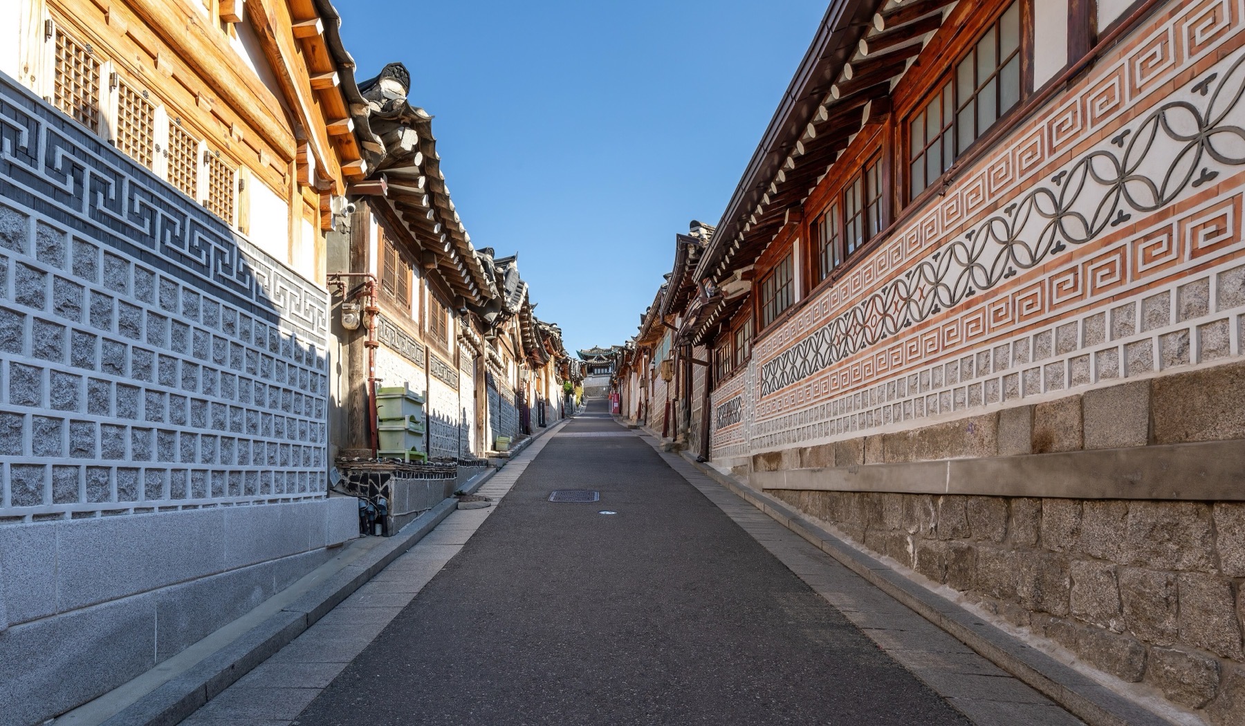 Hanok rooftops along a sloping lane in Bukchon, Seoul